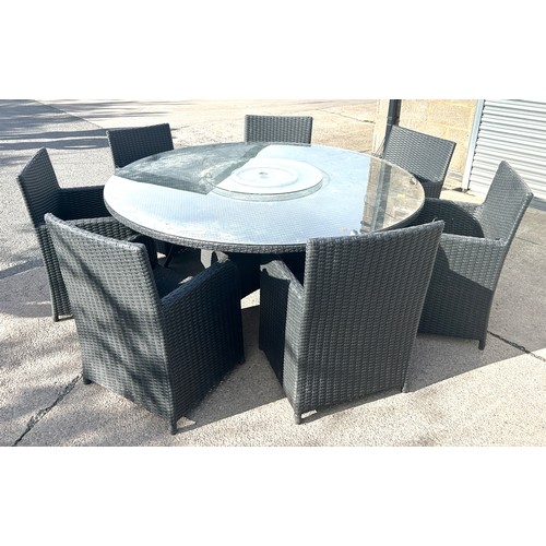 100L - Rattan lazy susie table and 8 chairs 22 inches diameter 29 inches tall