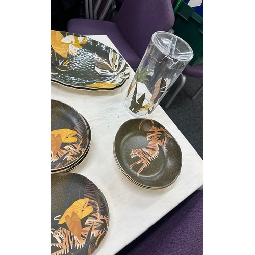 151 - Outdoor M&S matching animal print serving set to include cups, plates, serving plates, jug etc