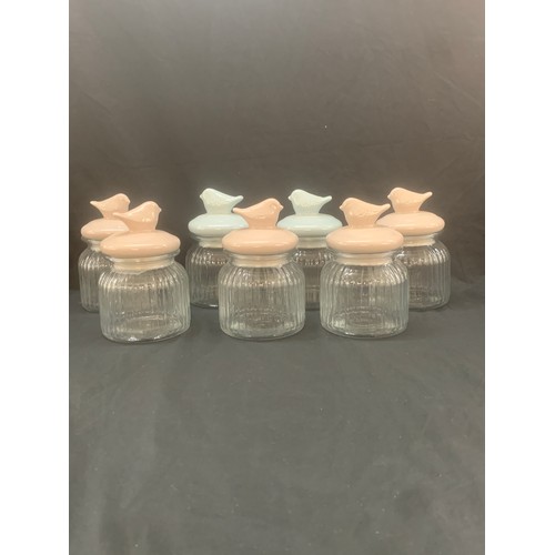 111 - Selection of 7 new glass jars, bird detailing to lids