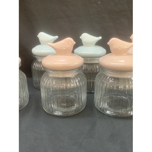 111 - Selection of 7 new glass jars, bird detailing to lids