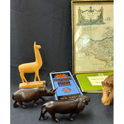 54 - Selection of maps to include Oxford, London, Somerset in frame, selection of wooden carved animals