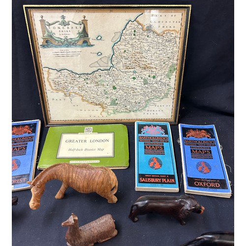 54 - Selection of maps to include Oxford, London, Somerset in frame, selection of wooden carved animals