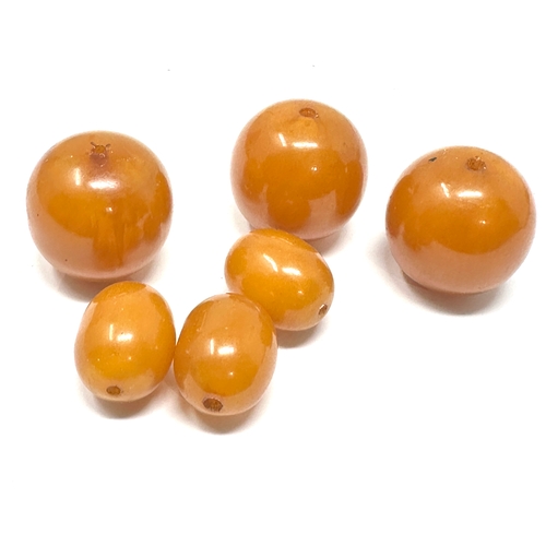 397 - Large Amber / bakelite beads weight 45.g largest bead measures approx 25mm dia