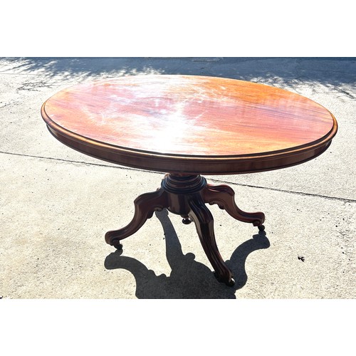 500A - Mahogany tilt top dining table, approximate measurements: Height 30 inches, Width 52 inches, Depth 4... 