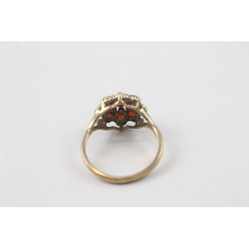 138 - 9ct gold garnet flower cluster ring (1.9g)