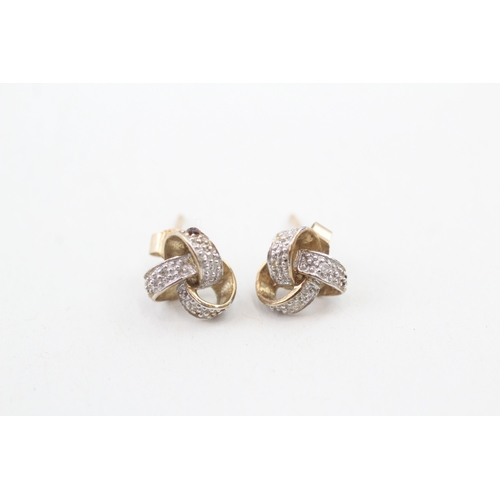 145 - 9ct gold diamond stud earrings (1.3g)