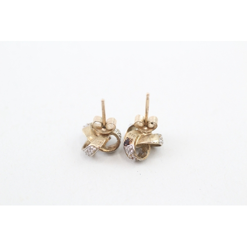 145 - 9ct gold diamond stud earrings (1.3g)