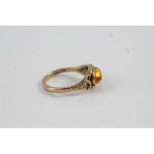 154 - 9ct gold and amber cabochon ring (2.1g)