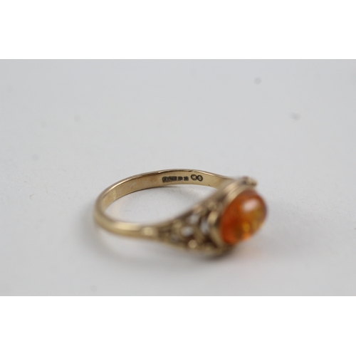 154 - 9ct gold and amber cabochon ring (2.1g)