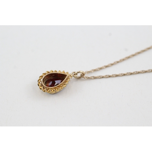 161 - 9ct gold garnet pendant on chain (2.7g)