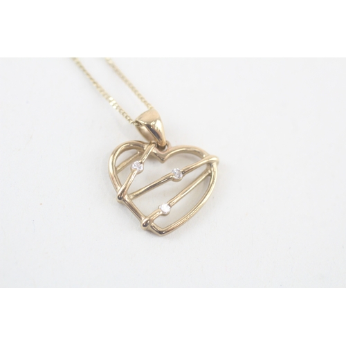 166 - 9ct gold white gemstone heart pendant on chain (1.8g)