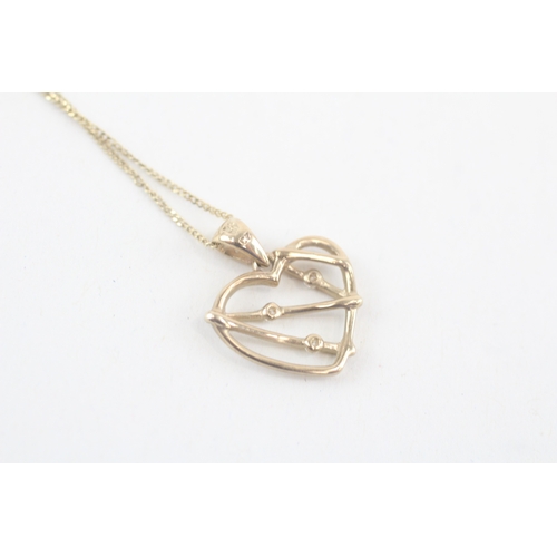 166 - 9ct gold white gemstone heart pendant on chain (1.8g)