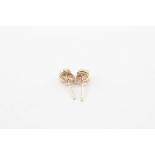 225 - 9ct gold diamond stud earrings (0.4g)