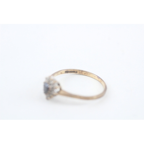 239 - 9ct gold sapphire & white gemstone dress ring (1.4g)