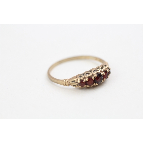 273 - 9ct gold garnet set five stone dress ring (1.4g)