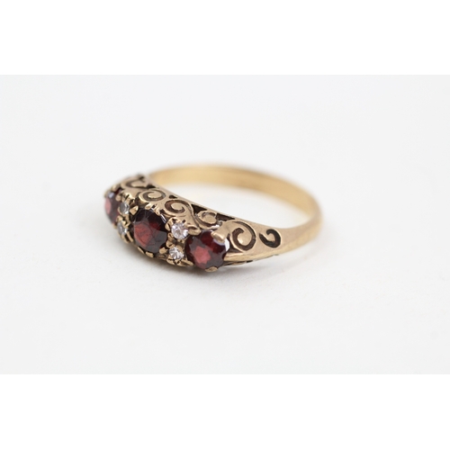 275 - 9ct gold garnet and cubic zirconia set boat shaped dress ring (3g)