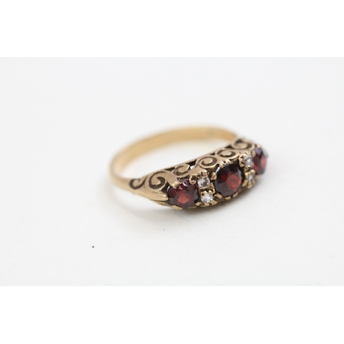 275 - 9ct gold garnet and cubic zirconia set boat shaped dress ring (3g)