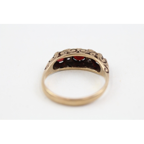 275 - 9ct gold garnet and cubic zirconia set boat shaped dress ring (3g)