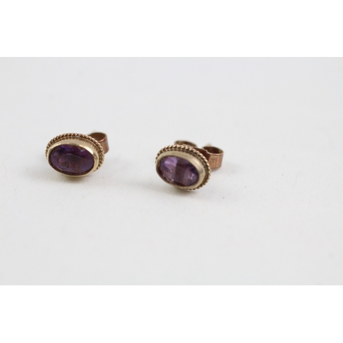 286 - 9ct gold amethyst single stone stud earrings (0.9g)