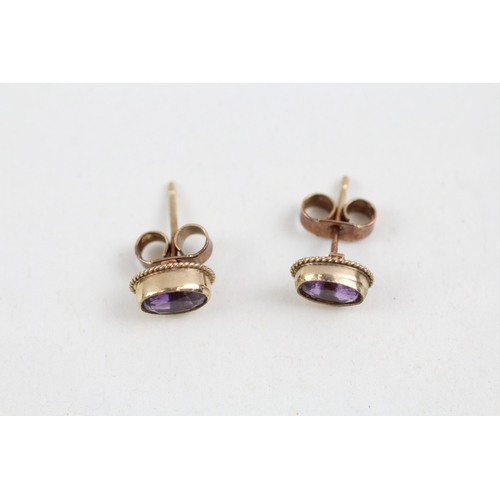 286 - 9ct gold amethyst single stone stud earrings (0.9g)