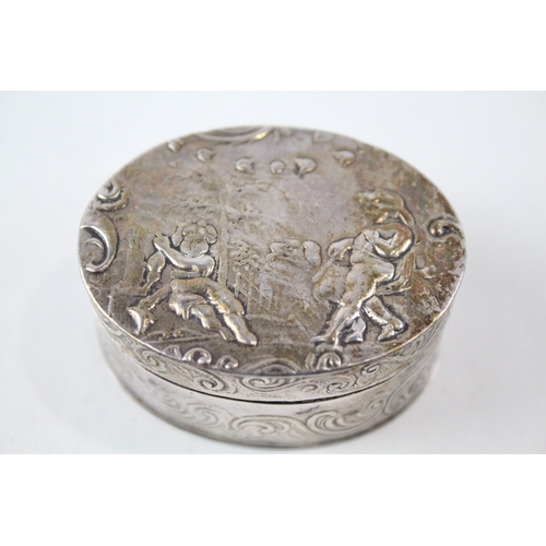 27 - .900 silver snuff box w/ cherub detail