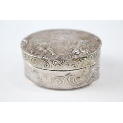 27 - .900 silver snuff box w/ cherub detail