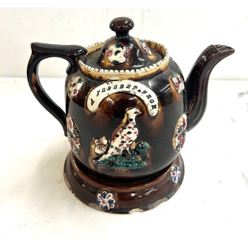 116 - Small Bargeware teapot with stand, small chips to base, overall height 7.5 inches