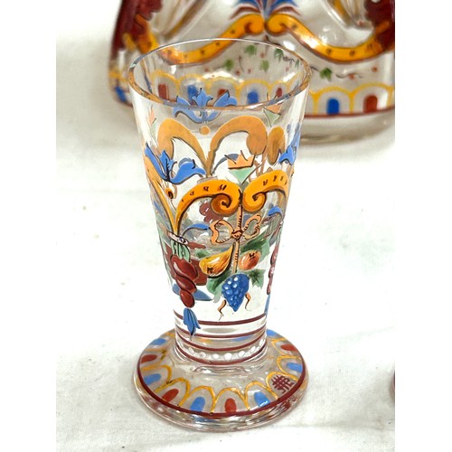 109 - Pair antique hand painted squeezed glass decanters with 4 cordials, height of decanter 10.5 inches