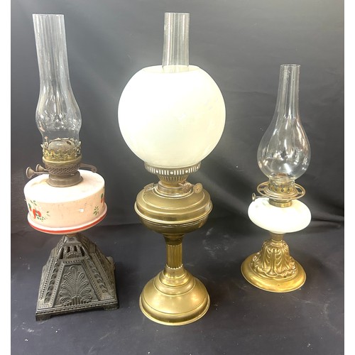 478 - 3 Vintage oil lamps, all with funnels one with shade