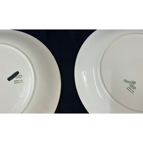 34 - Pair Clarice Cliff  wall plates, depicting a hunting dog and catch, diameter of plates 11 inches