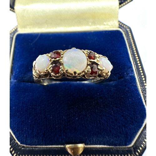 107 - 9ct gold opal & garnet ring weight 2.1g