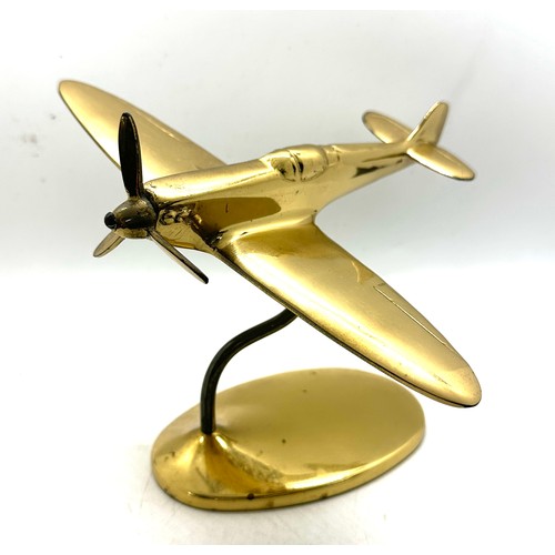 14 - A brass cast model of a Spitfire complete with stand measures approx 5 inches tall by 8 wide