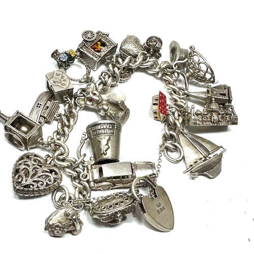 247 - Vintage Silver charm bracelet with opening charms etc weight 106g