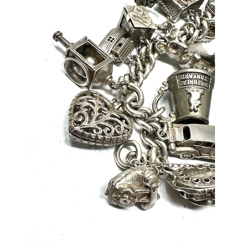 247 - Vintage Silver charm bracelet with opening charms etc weight 106g