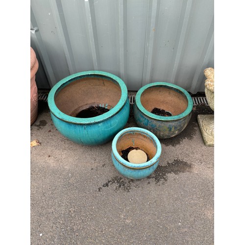 100J - Set of three glazed garden planter largest measures approximately 13 inches tall