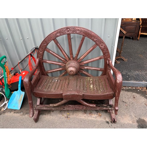 100Q - Wooden novelty wagon wheel garden bench measures approximately Height 49 inches, Length 48 inches