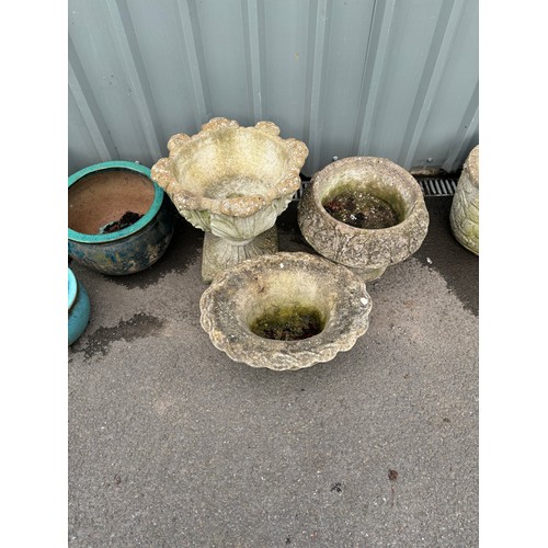 100T - Selection of three garden planters largest measures approximately 18 inches tall