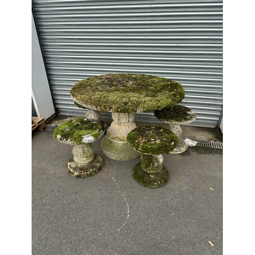 100U - Concrete garden table with 4 concrete garden stools table measures approximately 28 inches tall 41 i... 