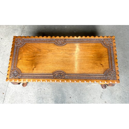 435B - Mahogany carved top coffee table, approximate measurements: Height 16 inches, Width 39 inches, Depth... 