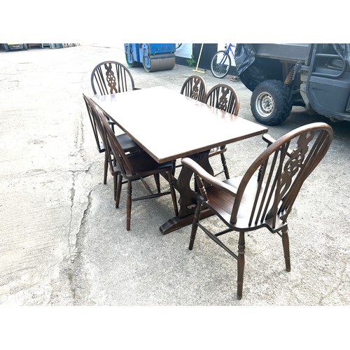 384 - Oak table and 6 wheelback chairs, Measurements of table Height 29 inches, Width 60 inches, Depth 30 ... 