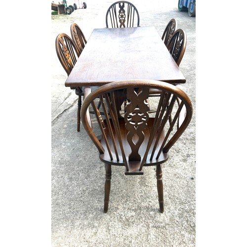 384 - Oak table and 6 wheelback chairs, Measurements of table Height 29 inches, Width 60 inches, Depth 30 ... 