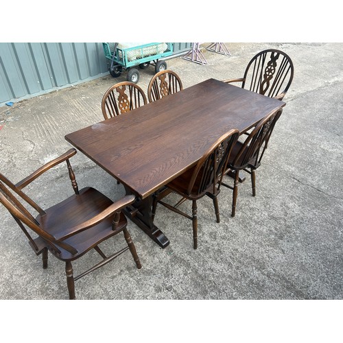 384 - Oak table and 6 wheelback chairs, Measurements of table Height 29 inches, Width 60 inches, Depth 30 ... 