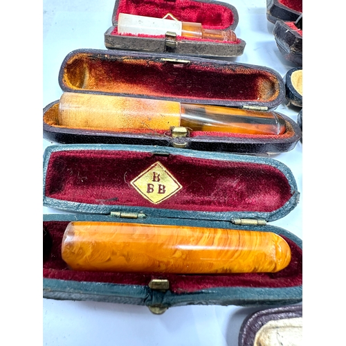 471 - selection of cased antique amber etc Cheroot  Holders