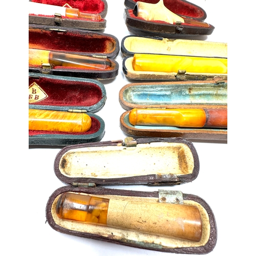 471 - selection of cased antique amber etc Cheroot  Holders