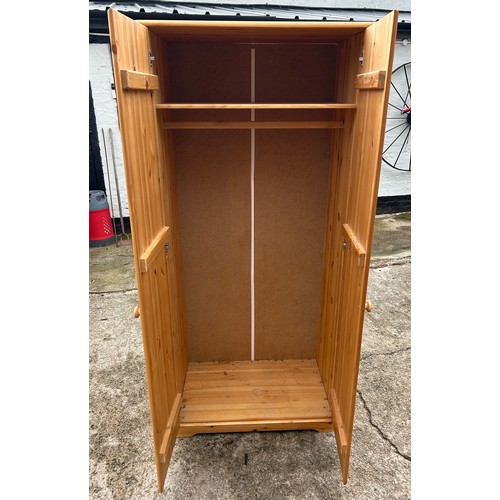 440 - 2 Door pine robe with shelf, hanging rail, approximate measurements: Height 70 inches Width 32 inche... 