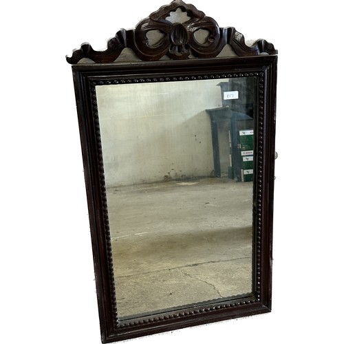 426 - Carved wood mirror measures approx 35 inches tall by 20 wide