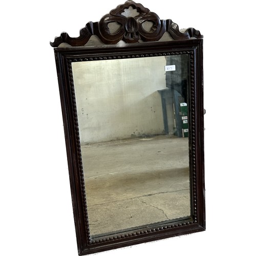 426 - Carved wood mirror measures approx 35 inches tall by 20 wide