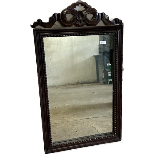 426 - Carved wood mirror measures approx 35 inches tall by 20 wide