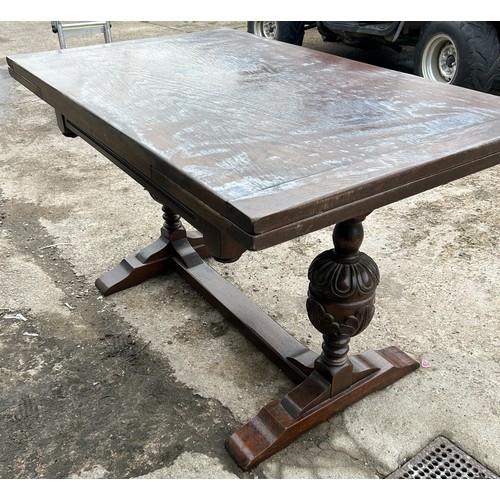 377 - Oak draw leaf table, baulbaus leg detailing, water damaged top approximate measurements: Height 30 i... 