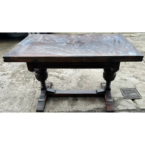 377 - Oak draw leaf table, baulbaus leg detailing, water damaged top approximate measurements: Height 30 i... 